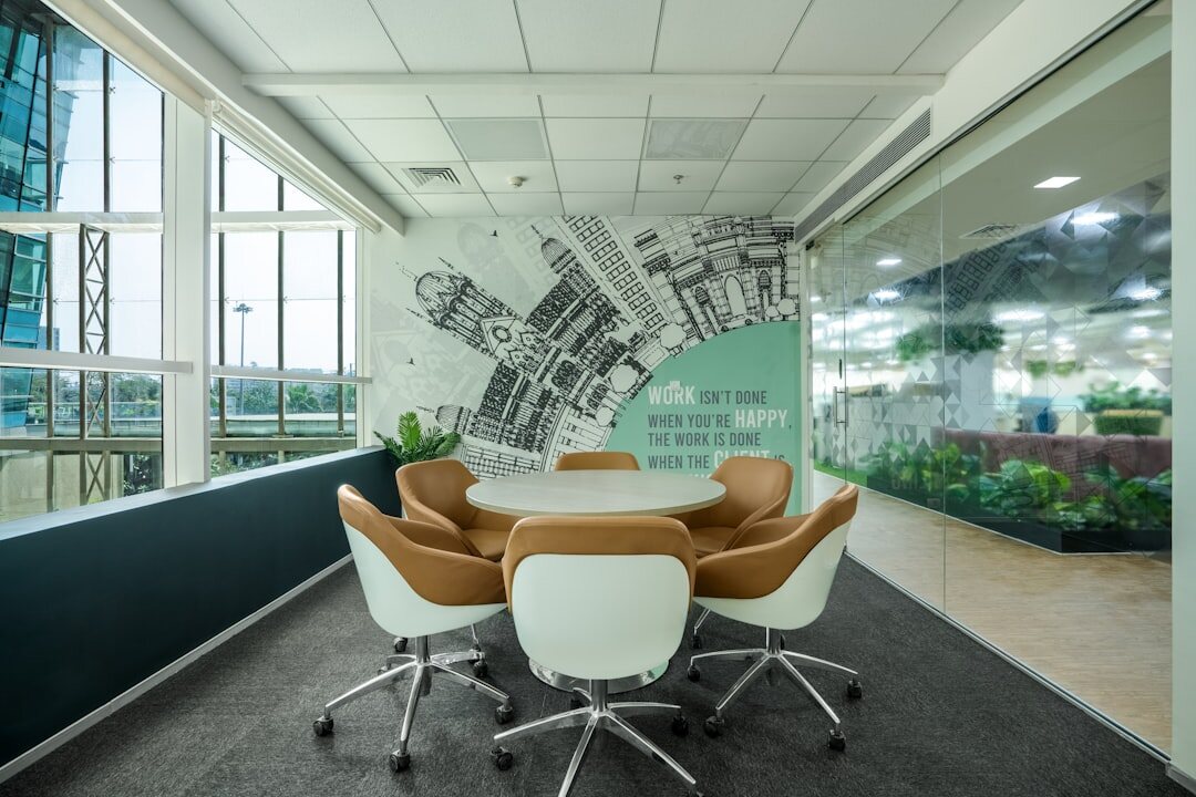 Modern bright newsroom office with desks and monitors